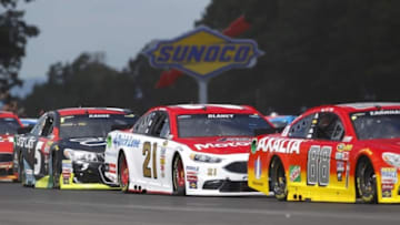 Aug 7, 2016; Watkins Glen, NY, USA; Sprint Cup Series drivers Ryan Blaney (21) and Kasey Kahne (5) during the Cheez-It 355 at Watkins Glen International. Mandatory Credit: Timothy T. Ludwig-USA TODAY Sports
