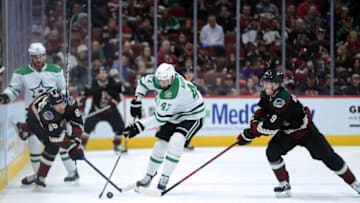 Nov 27, 2021; Glendale, Arizona, USA; Dallas Stars right wing Alexander Radulov (47) skates the puck against Arizona Coyotes defenseman Anton Stralman (86) and right wing Clayton Keller (9) during the third period at Gila River Arena. Mandatory Credit: Joe Camporeale-USA TODAY Sports