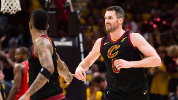 CLEVELAND, OH - MAY 7: JR Smith #5 celebrates with Kevin Love #0 of the Cleveland Cavaliers during the second half of Game 4 of the second round of the Eastern Conference playoffs against the Toronto Raptors at Quicken Loans Arena on May 7, 2018 in Cleveland, Ohio. The Cavaliers defeated the Raptors 128-93. NOTE TO USER: User expressly acknowledges and agrees that, by downloading and or using this photograph, User is consenting to the terms and conditions of the Getty Images License Agreement. (Photo by Jason Miller/Getty Images)