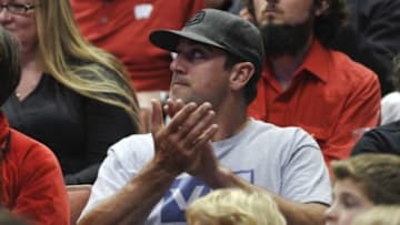 Mar 27, 2014; Anaheim, CA, USA; Green Bay Packers quarterback Aaron Rodgers watches during the second half in the semifinals of the west regional of the 2014 NCAA Mens Basketball Championship tournament between the Wisconsin Badgers and the Baylor Bears at Honda Center. Mandatory Credit: Robert Hanashiro-USA TODAY Sports