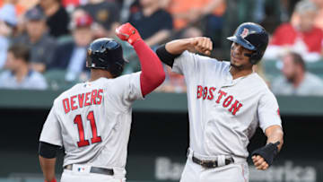 BALTIMORE, MD - JUNE 12: Rafael Devers #11 of the Boston Red Sox celebrates a two run home run with Xander Bogaerts #2 in the second inning during a baseball game against the Baltimore Orioles at Oriole Park at Camden Yards on June 12, 2018 in Baltimore, Maryland. (Photo by Mitchell Layton/Getty Images)