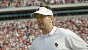 NORMAN, OK - NOVEMBER 15: Head coach Bob Stoops of the Oklahoma Sooners runs onto the field before a game against the Baylor Bears November 15, 2003 at Memorial Stadium in Norman, Oklahoma. The Sooners won 41-3 to stay undefeated at 10-0. (Photo by Brian Bahr/Getty Images)