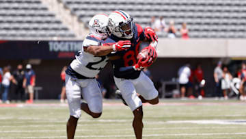 TUCSON, ARIZONA - APRIL 24: Wide receiver Stanley Berryhill III #86 of the Arizona Wildcats (Team Blue) makes a reception against Malik Hausman #23 (Team Red) during the Arizona Spring game at Arizona Stadium on April 24, 2021 in Tucson, Arizona. (Photo by Christian Petersen/Getty Images)