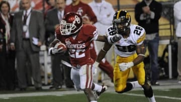 Dec 30, 2011; Tempe, AZ, USA; Iowa Hawkeyes defensive back Shaun Prater (28) pursues Oklahoma Sooners running back Roy Finch (22) during the second half of the 2011 Insight Bowl at the Sun Devil Stadium. Mandatory Credit: Richard Mackson-USA TODAY Sports