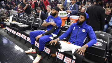 CLEVELAND, OHIO - FEBRUARY 09: Marcus Morris Sr. #31 and Paul George #13 of the LA Clippers sit on the bench prior to the game against the Cleveland Cavaliers at Rocket Mortgage Fieldhouse on February 09, 2020 in Cleveland, Ohio. NOTE TO USER: User expressly acknowledges and agrees that, by downloading and/or using this photograph, user is consenting to the terms and conditions of the Getty Images License Agreement. (Photo by Jason Miller/Getty Images)