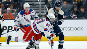 COLUMBUS, OHIO - OCTOBER 14: Mika Zibanejad #93 of the New York Rangers is knocked down by Adam Fantilli #11 of the Columbus Blue Jackets while battling for control of the puck during the first period of the game at Nationwide Arena on October 14, 2023 in Columbus, Ohio. (Photo by Kirk Irwin/Getty Images)
