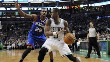 Apr 4, 2014; Boston, MA, USA; Philadelphia 76ers guard Elliot Williams (25) guards Boston Celtics guard Rajon Rondo (9) during the second half at TD Garden. Mandatory Credit: Bob DeChiara-USA TODAY Sports