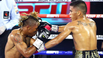 Mike Plania punches Joshua Greer Jr. (Photo by Mikey Williams/Top Rank via Getty Images)