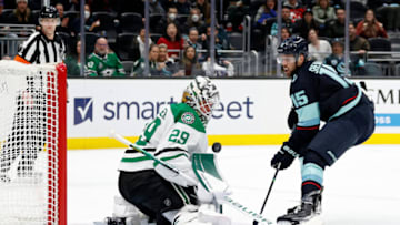 SEATTLE, WASHINGTON - APRIL 03: Jake Oettinger #29 of the Dallas Stars makes a save against Riley Sheahan #15 of the Seattle Kraken during the second period at Climate Pledge Arena on April 03, 2022 in Seattle, Washington. (Photo by Steph Chambers/Getty Images)