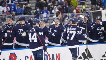 Mar 13, 2022; Hamilton, Ontario, CAN; The Toronto Maple Leafs bench celebrates a goal against Buffalo Sabres goaltender Craig Anderson (41) (not pictured) during the second period in the 2022 Heritage Classic ice hockey game at Tim Hortons Field. Mandatory Credit: John E. Sokolowski-USA TODAY Sports