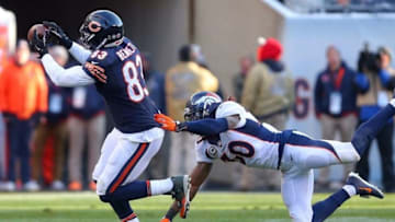 Nov 22, 2015; Chicago, IL, USA; Chicago Bears tight end Martellus Bennett (83) catches a pass in front of Denver Broncos strong safety David Bruton (30) during the second half at Soldier Field. Denver won 17-15. Mandatory Credit: Dennis Wierzbicki-USA TODAY Sports