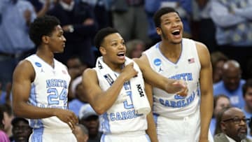 Mar 27, 2016; Philadelphia, PA, USA; North Carolina Tar Heels guard Kenny Williams (24), guard Nate Britt (0), and forward Kennedy Meeks (right) react during the second half against the Notre Dame Fighting Irish in the championship game in the East regional of the NCAA Tournament at Wells Fargo Center. Mandatory Credit: Bill Streicher-USA TODAY Sports