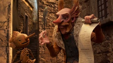 Guillermo del Toro's Pinocchio - (L-R) Pinocchio (voiced by Gregory Mann) and Count Volpe (voiced by Christoph Waltz). Cr: Netflix © 2022