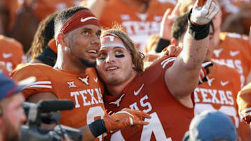 AUSTIN, TX - OCTOBER 13: Collin Johnson #9 of the Texas Longhorns and Breckyn Hager #44 celebrate after the game against the Baylor Bears at Darrell K Royal-Texas Memorial Stadium on October 13, 2018 in Austin, Texas. (Photo by Tim Warner/Getty Images)