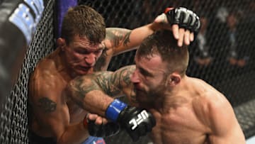 BOISE, ID - JULY 14: (R-L) Alexander Volkanovski of Australia elbows Darren Elkins in their featherweight fight during the UFC Fight Night event inside CenturyLink Arena on July 14, 2018 in Boise, Idaho. (Photo by Josh Hedges/Zuffa LLC/Zuffa LLC via Getty Images)
