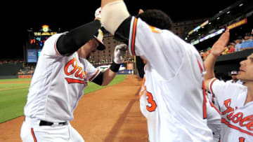 Jun 6, 2016; Baltimore, MD, USA; Baltimore Orioles catcher Matt Wieters (32) high fives shortstop Manny Machado (13) after hitting a home run in the seventh inning against the Kansas City Royals at Oriole Park at Camden Yards. The Baltimore Orioles won 4-1. Mandatory Credit: Evan Habeeb-USA TODAY Sports