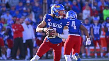 Oct 7, 2023; Lawrence, Kansas, USA; Kansas Jayhawks quarterback Jason Bean (9) drops back during the second half against the UCF Knights at David Booth Kansas Memorial Stadium. Mandatory Credit: Peter Aiken-USA TODAY Sports