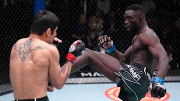 LAS VEGAS, NEVADA - FEBRUARY 19: (R-L) David Onama of Uganda kicks Gabriel Benitez of Mexico in their featherweight fight during the UFC Fight Night event at UFC APEX on February 19, 2022 in Las Vegas, Nevada. (Photo by Jeff Bottari/Zuffa LLC)