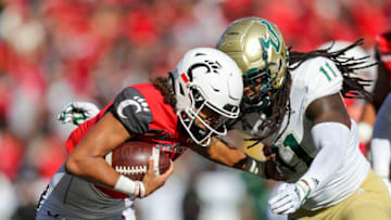 Cincinnati Bearcats quarterback Evan Prater runs the ball against the South Florida Bulls. USA Today.