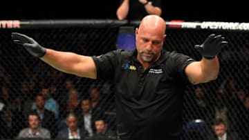 BUFFALO, NY - APRIL 08: Referee Dan Miragliotta calls off the fight between Chris Weidman and Gegard Mousasi of the Netherlands in their middleweight bout during the UFC 210 event at KeyBank Center on April 8, 2017 in Buffalo, New York. (Photo by Josh Hedges/Zuffa LLC/Zuffa LLC via Getty Images)
