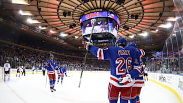 NEW YORK, NEW YORK - DECEMBER 19: The New York Rangers celebrate a goal by Paul Carey