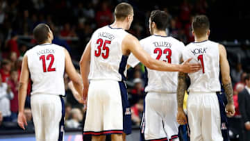 Mar 17, 2016; Providence, RI, USA; Arizona Wildcats forward Ryan Anderson (12) and center Kaleb Tarczewski (35) forward Mark Tollefsen (23) and guard Gabe York (1) walk off of the court during the second half of a first round game against the Wichita State Shockers in the 2016 NCAA Tournament at Dunkin Donuts Center. Mandatory Credit: Mark L. Baer-USA TODAY Sports