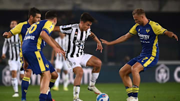 Juventus' Argentine forward Paulo Dybala (C) and Hellas Verona's Czech midfielder Antonin Barak (R) go for the ball during the Italian Serie A football match between Hellas Verona and Juventus on October 30, 2021 at the Bentegodi stadium in Verona. (Photo by Marco BERTORELLO / AFP) (Photo by MARCO BERTORELLO/AFP via Getty Images)