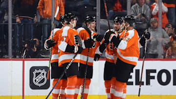 PHILADELPHIA, PENNSYLVANIA - OCTOBER 04: Owen Tippett #74 of the Philadelphia Flyers (C) celebrates with teammates after scoring during the third period against the New York Islanders at Wells Fargo Center on October 04, 2022 in Philadelphia, Pennsylvania. (Photo by Tim Nwachukwu/Getty Images)