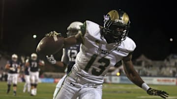 Oct 11, 2014; Reno, NV, USA; Colorado State Rams defensive back Elliott DeAndre (13) intercepts a pass by Nevada Wolf Pack quarterback Cody Fajardo (not pictured) in the Nevada end zone that preserved their 31-24 win at MacKay Stadium. Mandatory Credit: Lance Iversen-USA TODAY Sports