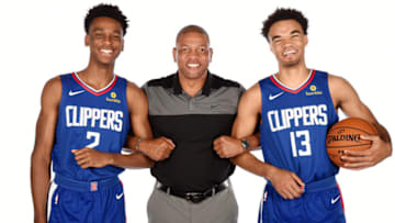 PLAYA VISTA, CA - JUNE 25: Draft picks Shai Gilgeous-Alexander #2 and Jerome Robinson #13 of the LA Clippers pose for a photo with Head Coach Doc Rivers during the Draft Press Conference at the Clippers Training Facility in Playa Vista, California on June 25, 2018 at Clippers Training Facility. NOTE TO USER: User expressly acknowledges and agrees that, by downloading and or using this photograph, User is consenting to the terms and conditions of the Getty Images License Agreement. Mandatory Copyright Notice: Copyright 2018 NBAE (Photo by Andrew D. Bernstein/NBAE via Getty Images)