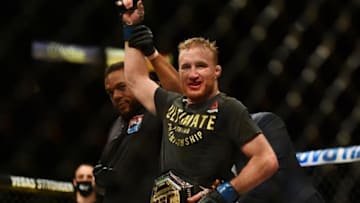 May 9, 2020; Jacksonville, Florida, USA; Dana White puts the championship belt on Justin Gaethje (blue gloves) after defeating Tony Ferguson (red gloves) during UFC 249 at VyStar Veterans Memorial Arena. Mandatory Credit: Jasen Vinlove-USA TODAY Sports
