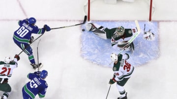 VANCOUVER, BC - OCTOBER 29: Devan Dubnyk #40 of the Minnesota Wild makes a save on Markus Granlund #60 of the Vancouver Canucks during their NHL game at Rogers Arena October 29, 2018 in Vancouver, British Columbia, Canada. (Photo by Jeff Vinnick/NHLI via Getty Images)"n