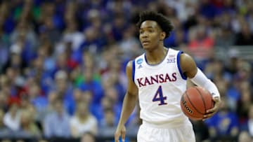 KANSAS CITY, MO - MARCH 23: Devonte' Graham #4 of the Kansas Jayhawks handles the ball against the Purdue Boilermakers during the 2017 NCAA Men's Basketball Tournament Midwest Regional at Sprint Center on March 23, 2017 in Kansas City, Missouri. (Photo by Jamie Squire/Getty Images)