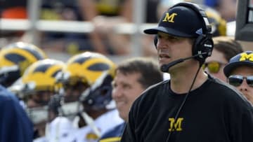 Jan 1, 2016; Orlando, FL, USA; Michigan Wolverines head coach Jim Harbaugh has water dumped on him after defeating Florida Gators to 41-7 to win the 2016 Citrus Bowl at Orlando Citrus Bowl Stadium. Michigan Wolverines defeated Florida Gators 41-7. Mandatory Credit: Tommy Gilligan-USA TODAY Sports