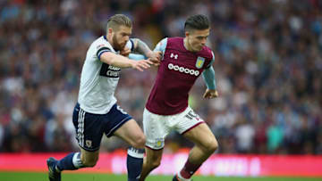 BIRMINGHAM, ENGLAND - MAY 15: Jack Grealish of Aston Villa is tackled by Adam Clayton of Middlesbrough during the Sky Bet Championship Play Off Semi Final:Second Leg match between Aston Villa and Middlesbrough at Villa Park on May 15, 2018 in Birmingham, England. (Photo by Clive Mason/Getty Images)