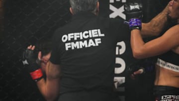 PARIS, FRANCE - OCTOBER 30: The referee stops the fight between Lucie Bertaud and Karla Benitez during the Mixed Martial Arts fights event "Hexagone MMA 2" at Zenith de La Villette, on October 30, 2021 in Paris, France. (Photo by Edward Berthelot/Getty Images)