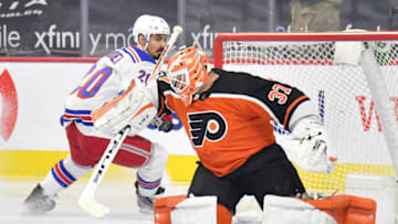 Feb 24, 2021; Philadelphia, Pennsylvania, USA; Philadelphia Flyers goaltender Brian Elliott (37) makes a save against New York Rangers left wing Chris Kreider (20) during the first period at Wells Fargo Center. Mandatory Credit: Eric Hartline-USA TODAY Sports