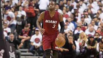 May 15, 2016; Toronto, Ontario, CAN; Miami Heat guard Dwyane Wade (3) dribbles the ball up court during the second quarter in game seven of the second round of the NBA Playoffs against the Toronto Raptors at Air Canada Centre. The Toronto Raptors won 116-89. Mandatory Credit: Nick Turchiaro-USA TODAY Sports