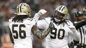 CHICAGO, ILLINOIS - OCTOBER 20: Demario Davis #56 of the New Orleans Saints is congratulated by Malcom Brown #90 after a play during the second half against the Chicago Bears at Soldier Field on October 20, 2019 in Chicago, Illinois. (Photo by Nuccio DiNuzzo/Getty Images)