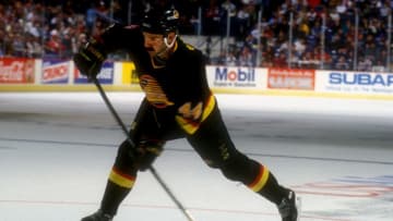 LANDOVER, MD - NOVEMBER 5: Dave Babych #44 of the Vancouver Canucks takes a shot during a hockey game against the Washington Capitals on November 5, 1993 at the USAir Arena in Landover, Maryland. The Capitals won 3-2. (Photo by Mitchell Layton/Getty Images)