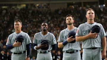 TOKYO, JAPAN - MARCH 21: Members of the Seattle Mariners stand for the national anthem ahead of their game against the Oakland Athletics during the 2019 Opening Series at the Tokyo Dome on Thursday, March 21, 2019 in Tokyo, Japan. (Photo by Alex Trautwig/MLB Photos via Getty Images)