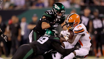 EAST RUTHERFORD, NEW JERSEY - SEPTEMBER 16: D'Ernest Johnson #30 of the Cleveland Browns is tackled by Kyle Phillips #98 and Blake Cashman #53 of the New York Jets in the second quarter at MetLife Stadium on September 16, 2019 in East Rutherford, New Jersey. (Photo by Elsa/Getty Images)