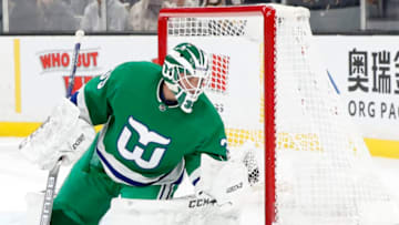 BOSTON, MA - MARCH 05: Carolina Hurricanes goalie Curtis McElhinney (35) makes a glove save during a game between the Boston Bruins and the Carolina Hurricanes on March 5, 2019, at TD Garden in Boston, Massachusetts. (Photo by Fred Kfoury III/Icon Sportswire via Getty Images)