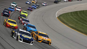 JOLIET, IL - JULY 01: Chase Elliott, driver of the #9 NAPA Auto Parts Chevrolet, and Erik Jones, driver of the #20 DeWalt Toyota, lead a pack of cars during the Monster Energy NASCAR Cup Series Overton's 400 at Chicagoland Speedway on July 1, 2018 in Joliet, Illinois. (Photo by Jonathan Daniel/Getty Images)