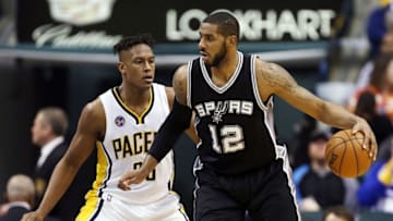 Mar 7, 2016; Indianapolis, IN, USA; San Antonio Spurs forward LaMarcus Aldridge (12) is guarded by Indiana Pacers center Myles Turner (33) at Bankers Life Fieldhouse. Indiana defeats San Antonio 99-91. Mandatory Credit: Brian Spurlock-USA TODAY Sports