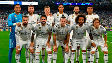 (FromL, up) Real Madrid's Costa Rican goalkeeper Keylor Navas, Real Madrid's Spanish defender Sergio Ramos, Real Madrid's German midfielder Toni Kroos, Real Madrid's French defender Raphael Varane, Real Madrid's French forward Karim Benzema, Real Madrid's Brazilian midfielder Casemiro, (down) Real Madrid's Spanish defender Dani Carvajal, Real Madrid's Spanish midfielder Isco, Real Madrid's Welsh forward Gareth Bale, Real Madrid's Brazilian defender Marcelo and Real Madrid's Croatian midfielder Luka Modric pose before the UEFA Champions League group G football match between Real Madrid CF and AS Roma at the Santiago Bernabeu stadium in Madrid on September 19, 2018. (Photo by GABRIEL BOUYS / AFP) (Photo credit should read GABRIEL BOUYS/AFP/Getty Images)
