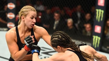 DETROIT, MI - DECEMBER 02: (L-R) Amanda Cooper punches Angela Magana in their women's strawweight bout during the UFC 218 event inside Little Caesars Arena on December 02, 2017 in Detroit, Michigan. (Photo by Josh Hedges/Zuffa LLC/Zuffa LLC via Getty Images)