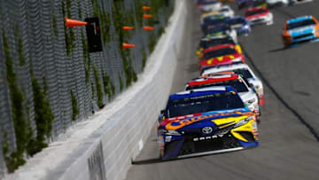 LONG POND, PA - JULY 30: Kyle Busch, driver of the #18 M&M's Caramel Toyota, leads a pack of cars during the Monster Energy NASCAR Cup Series Overton's 400 at Pocono Raceway on July 30, 2017 in Long Pond, Pennsylvania. (Photo by Jonathan Ferrey/Getty Images)