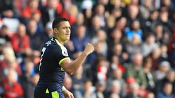 Arsenal's Chilean striker Alexis Sanchez celebrates scoring the opening goal during the English Premier League football match between Sunderland and Arsenal at the Stadium of Light in Sunderland, northeast England on October 29, 2016. / AFP / Lindsey PARNABY / RESTRICTED TO EDITORIAL USE. No use with unauthorized audio, video, data, fixture lists, club/league logos or 'live' services. Online in-match use limited to 75 images, no video emulation. No use in betting, games or single club/league/player publications. / (Photo credit should read LINDSEY PARNABY/AFP/Getty Images)