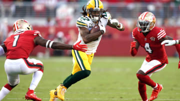 Sep 26, 2021; Santa Clara, California, USA; Green Bay Packers wide receiver Davante Adams (17) runs between San Francisco 49ers cornerback Jimmie Ward (1) and defensive back Emmanuel Moseley (4) after a catch during the second quarter at Levi's Stadium. Mandatory Credit: Darren Yamashita-USA TODAY Sports